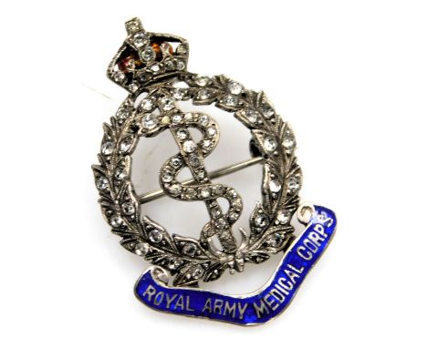 A Royal Army Medical Corps paste and enamel badge, set in white metal, dated 25.12.39.
