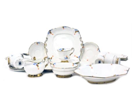 An early 20thC Paragon porcelain part tea service, painted with flowers, comprising bread plate, cream jug, sugar bowl, seven