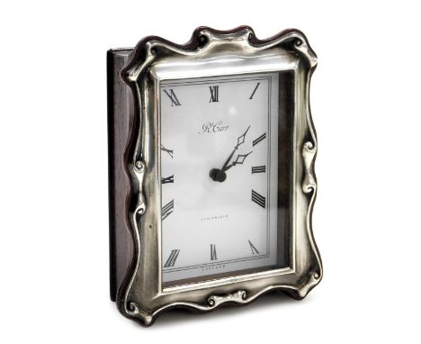 An R Carr silver and mahogany cased strut clock, rectangular dial bearing Roman numerals, battery movement, the back with sil