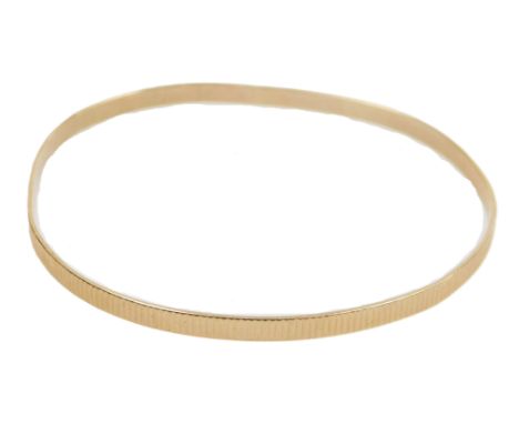 A 9ct gold bangle, 8.1g.