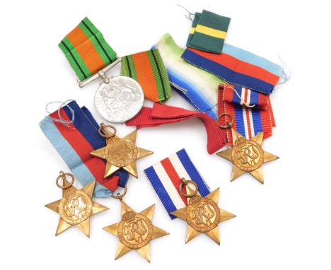 Various WWII medals, including 1939-45 Defence Medal, four 1939-45 Stars, and a France and Germany Star, and various medal ri