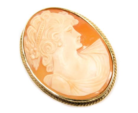 A shell cameo brooch, bust portrait of a lady, in a yellow metal mount. 