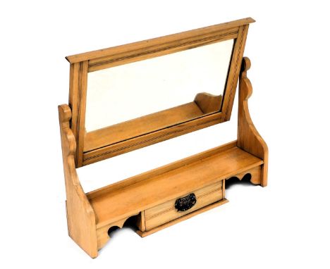 A Victorian satin walnut swing frame mirror, with a rectangular bevelled glass plate, above a shelf and single frieze drawer,