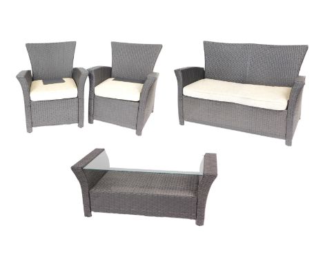 A rattan four piece conservatory suite, comprising a two seater sofa, 140cm wide, pair of armchairs, and a coffee table, 109c