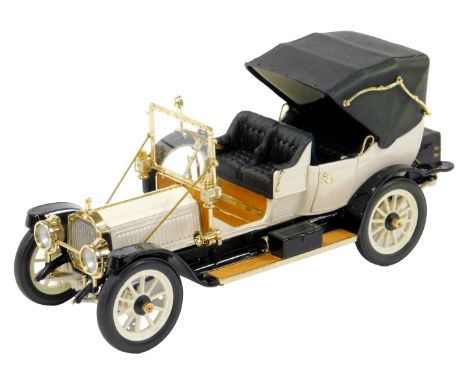 A Franklin Mint diecast model of a 1912 Packard Victoria, with details of the engine compartment and driving compartment layo