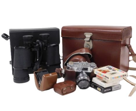 A Helina Super camera, with light meter and other accessories, cased, together with a pair of Regent 16x50 field binoculars, 