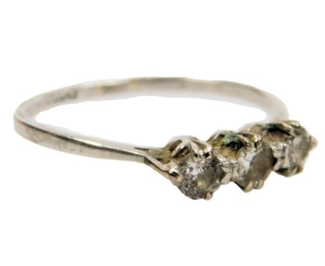 A diamond three stone ring, high claw set, in white metal, stamped platinum, approximately ⅜?ct, size K, 2.0g.