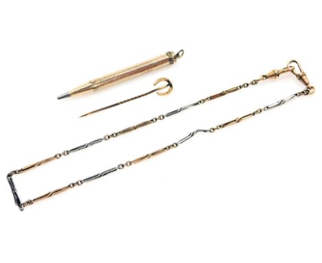 A 9ct gold horseshoe mounted stick pin, 0.7g, a gold plated watch chain, with two clips, and a rolled gold pencil case. (3) 