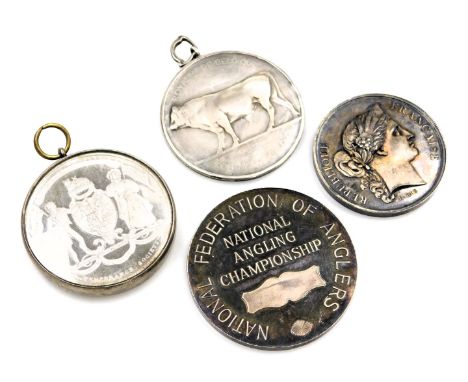 A group of silver and white metal associated medallions, comprising The Silver Agricultural medallion, a silver National Angl