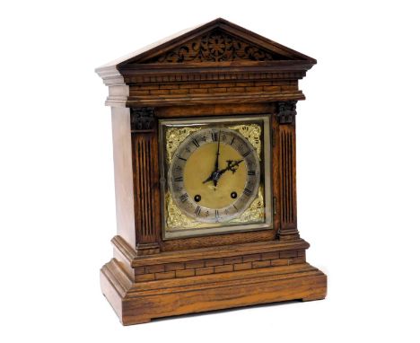 A Victorian oak case mantel clock, square brass dial, with cherub spandrels, silvered chapter ring bearing Roman numerals, ei