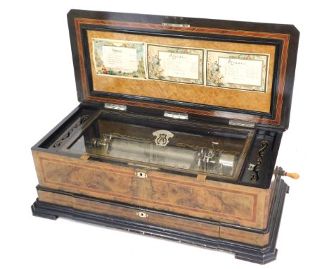 A late 19thC Swiss walnut and ebonised cased music box, with bone escutcheons, playing eighteen aires, the case with mother o