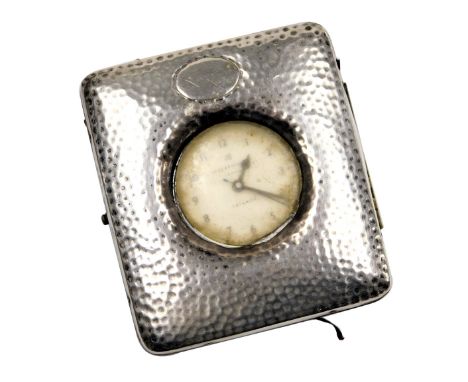 A Victorian travel watch case, with maroon leather fitment, and applied and hammered silver frontage, with a Ingersoll Triump