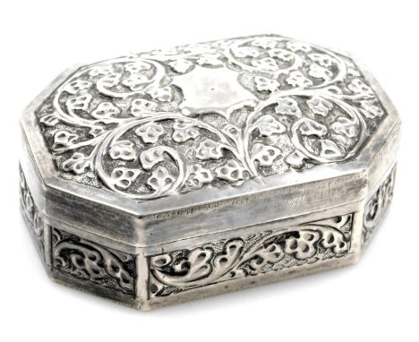 A Victorian silver patch box, of octagonal form with embossed floral scroll decoration and a vacant cartouche, London 1890, 2