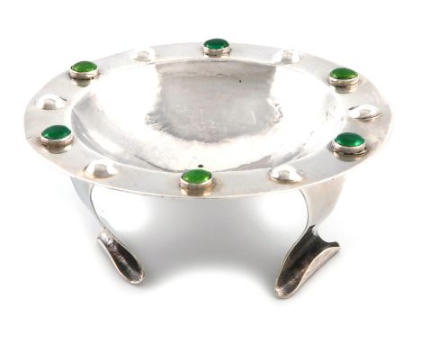 By A. E. Bonner, an Arts and Crafts silver dish, London 1907, circular form, with a border of alternated stamped bead and two