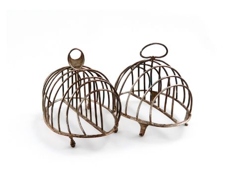 A George III silver seven-bar toast rack, by Henry Green, London 1793, oval form, wire-work bars, with a central carrying han