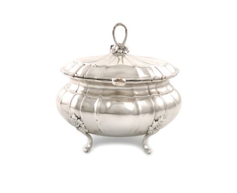 A German silver tea caddy / sugar box, circa 1920, lobed oval bellied form, the hinged cover with a foliate finial, on four f