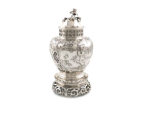 A late-Victorian silver tea caddy and stand, by the Goldsmiths and Silversmiths Company, London 1900, baluster form, the dome