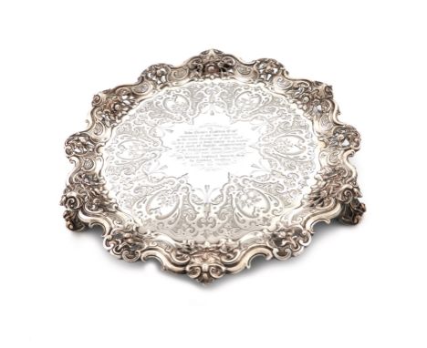A Victorian presentation silver salver, by The Barnards, London 1852, circular form, pierced foliate scroll border, the centr