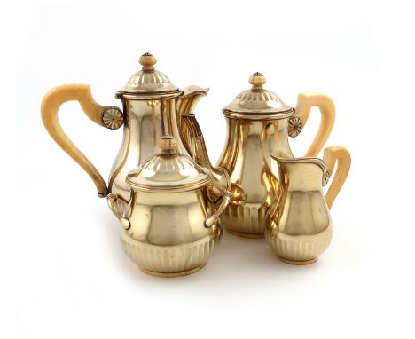 λA four-piece French silver-gilt bachelor's tea and coffee set, circa 1900, by R.L crowned for Robert Linzeier, the bases sta