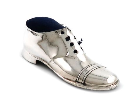 An Edwardian novelty silver shoe pin cushion, by S. Blanckensee and Sons Ltd,  Chester 1910, lacking laces, with a wooden sol