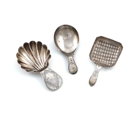 A George III silver Bright-cut caddy spoon, by John McFerlan, London 1785, shell shaped bowl, plus a George III caddy spoon, 