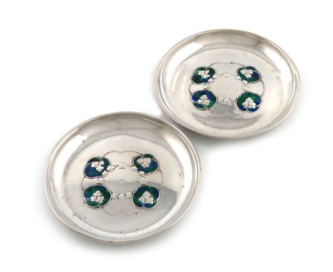 Designed by Jessie M. King, for W.H. Haseler, a pair of Edwardian Arts and Crafts silver and enamel pin dishes, Birmingham 19