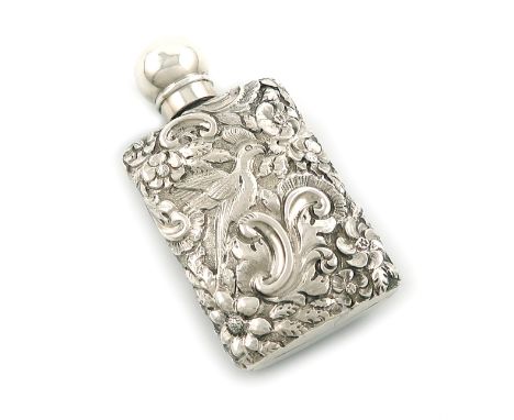 A Victorian silver scent flask, by S. Mordan and Co, London 1890, oval rectangular form, embossed with birds and foliate scro