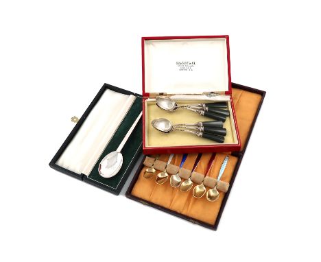 A set of six silver and enamel coffee spoons, by J. Tostrup, the handles with vari-coloured enamel decoration, in a fitted ca