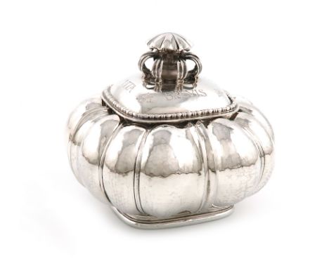 By Omar Ramsden, an Arts and Crafts silver caddy, London 1929, also engraved 'OMAR RAMSDEN ME FECIT', shaped square and lobed