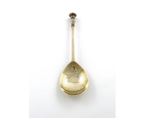 A James I West Country silver-gilt  Barnstaple Decorated Seal-top spoon, by John Quick, Barnstaple circa 1620, fig-shaped bow