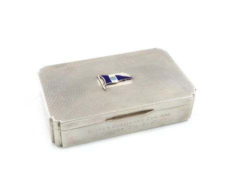 A presentation silver and enamel cigarette box, by Sanders &amp; Mackenzie, Birmingham 1936, rectangular form, rounded corner