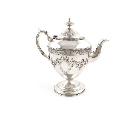 λA Victorian silver teapot, by Messrs. Lias, London 1872, vase form, embossed foliate decoration, scroll handle with ivory in