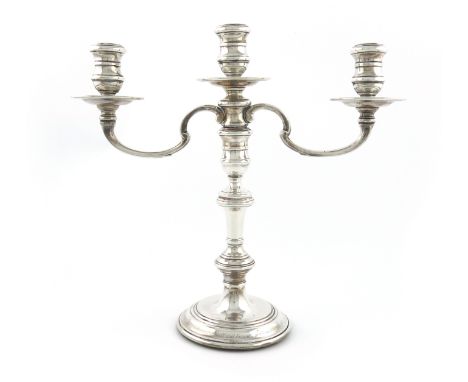 A modern silver three-light candelabrum, by R. Comyns, London 1962, in the George I manner, knopped columns, spool-shaped cap