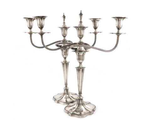 a pair of silver three-light candelabra, by A. Crichton, London 1919, tapering shaped oval form, reeded scroll arms, urn shap