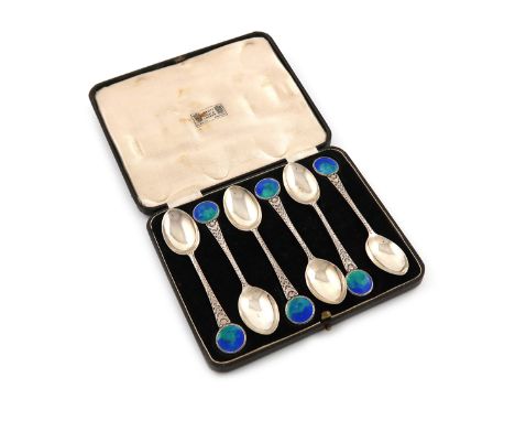 By W. H. Haseler for Liberty, a set of six silver and enamel teaspoons, Birmingham 1914, the tapering stems with chased decor