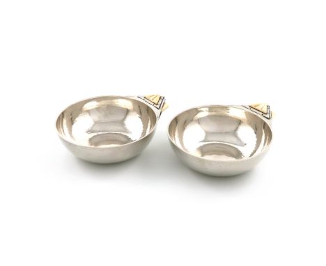 λBy R. E. Stone, a pair of Art Deco dishes, London 1931, also signed 'R. E. Stone' circular form, spot-hammered decoration, w