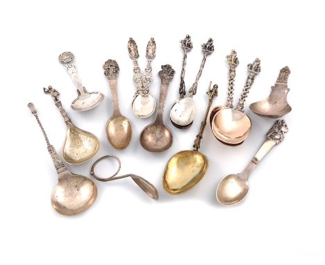 A collection of foreign silver and metalware spoons, comprising: a 19th century Dutch silver-gilt spoon, the finial with a fi