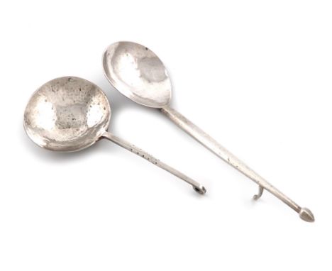 By Amy Sandheim, an Arts and Crafts silver spoon, London 1931, spot-hammered circular bowl, the stem with a scroll terminal, 