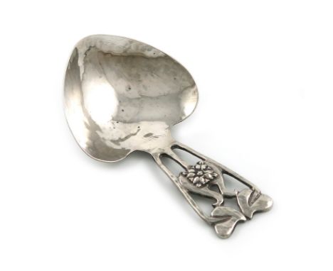 By A .E. Jones, a silver Art Nouveau caddy spoon, Birmingham 1915, heart-shaped bowl, the handle with pierced Art Nouveau fol