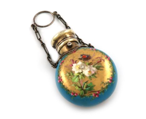 A Victorian silver-gilt mounted ceramic scent bottle, by S. Mordan, London 1873, circular form, the blue body decorated with 