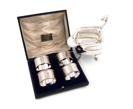 A cased set of four silver napkin rings, by Martin, Hall and Co, Sheffield 1918, retailed by The Goldsmiths Company, Cardiff,