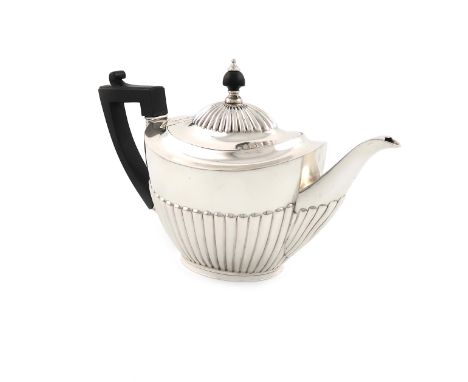 A late-Victorian silver teapot, by Gibson and Langman, Sheffield 1890, oval form, part-fluted decoration, scroll handle, flus