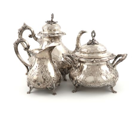 λA three-piece late 19th century Belgian silver tea set, circa 1880, baluster form, embossed with foliate scroll decoration, 