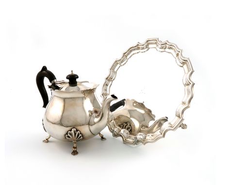 A late-Victorian silver teapot, by Charles Piling, London 1900, baluster form, wavy-edge border, on four hoof feet, plus a si