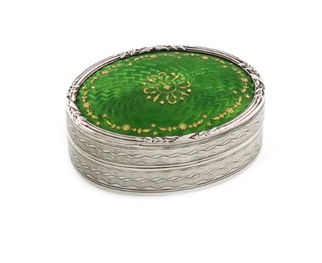 By Liberty and Co, an Edwardian silver and enamel box, Birmingham 1909, oval form, the hinged cover with green enamel decorat