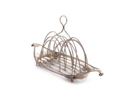 A George III silver toast rack, by Robert Hennell, London 1785, oval navette form, fluted ends, with wire-work bars and a cen