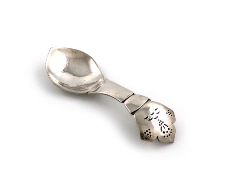 By H. G. Murphy, an Arts and Crafts silver caddy spoon, London 1928, shaped oval bowl, spot-hammered decoration, the shaped h
