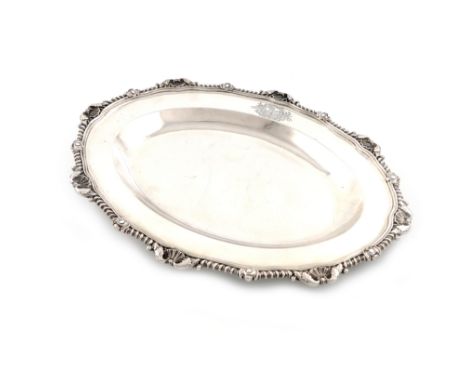 A George III silver meat platter, by Paul Storr, London 1808, shaped oval form, gadroon and foliate shell border, engraved wi