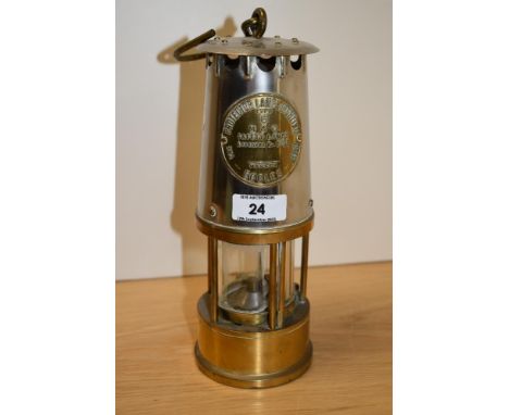 A stainless steel Eccles Type 6 miner's lamp, with applied brass manufacturer's plaque, measuring 26cm tall