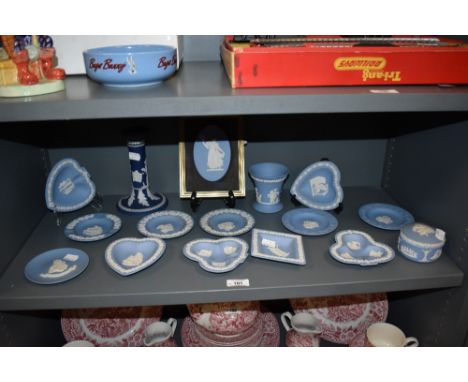 A collection of Wedgwood Jasperware pin dishes, trinket dish, vase, candlestick and similar.